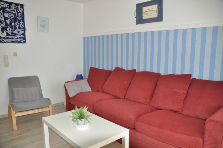 Wohnzimmer mit Schlafsofa