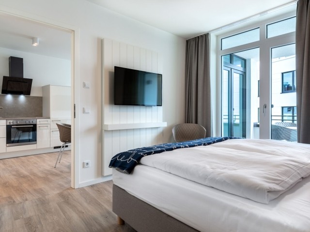 Das Schlafzimmer mit TV.