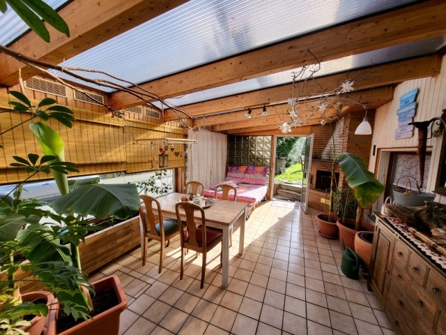 Ihr Wintergarten mit Bananenstauden, Mandarinen, Zitronen und offenem Kamin