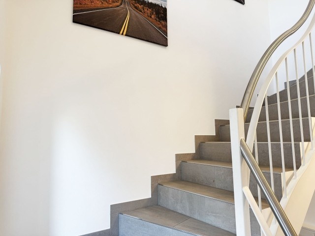 Treppe in das Obergeschoss