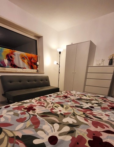 Schlafzimmer mit Beistellsofa