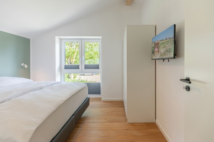 Huus Eekboom- großes Schlafzimmer mit Doppelbett  Huus Eekboom- großes Schlafzimmer mit Doppelbett
