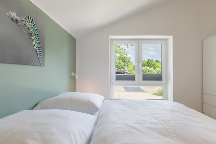 Huus Eekboom- großes Schlafzimmer mit Doppelbett Huus Eekboom- großes Schlafzimmer mit Doppelbett
