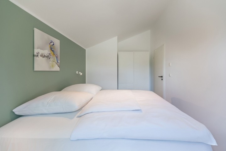 Huus Eekboom- helles Schlafzimmer mit Doppelbett  Huus Eekboom- helles Schlafzimmer mit Doppelbett