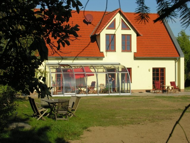 Die Südseite des Hauses mit Wintergarten Die Südseite des Hauses mit Wintergarten