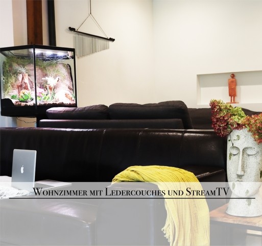 Wohnzimmer mit zusätzlicher Sitzecke und Musikbereich