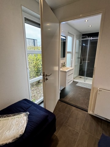 Der Zugang zum Bad über beide Schlafzimmer ist sehr praktisch