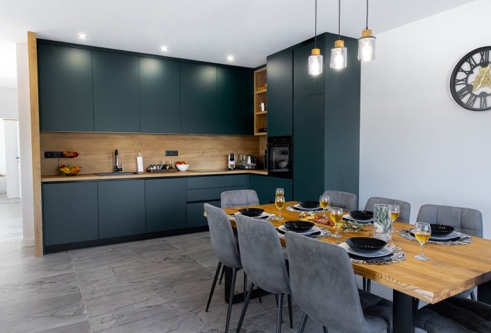 The dining room offers a warm and inviting space to share delicious meals with your favorite people.