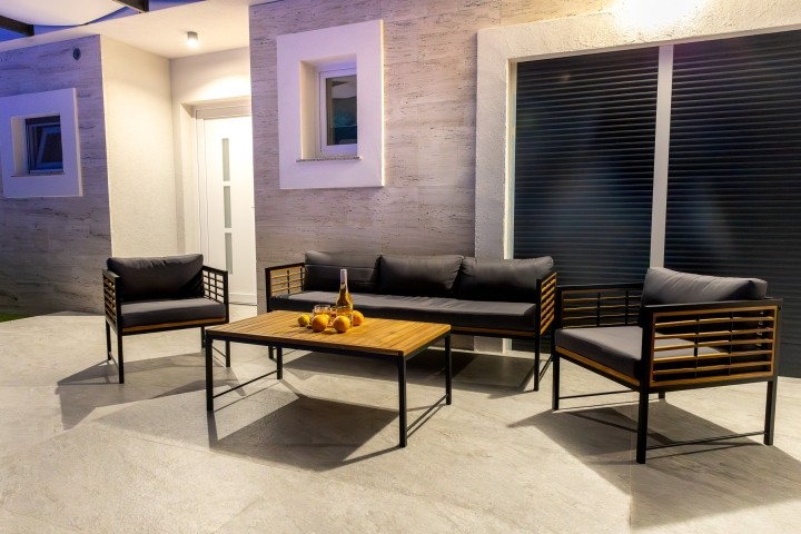 Relaxing by the pool in the evening hours, surrounded by tranquility and soft lighting.